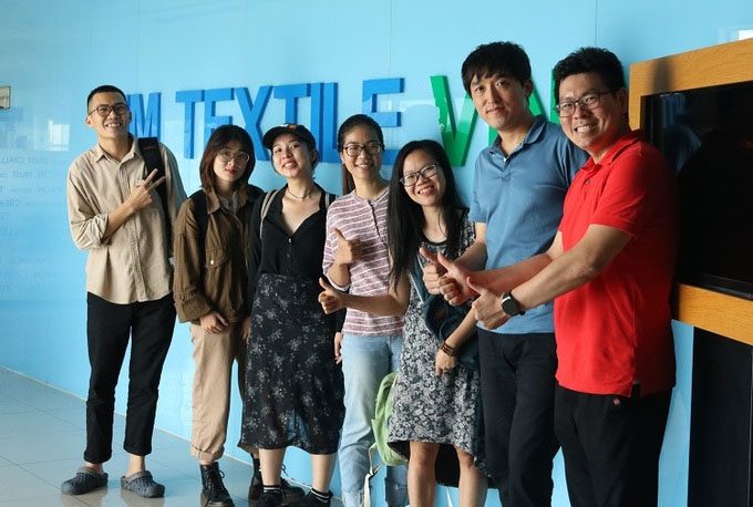 Bình (far left) and his associates during a meeting with partners.