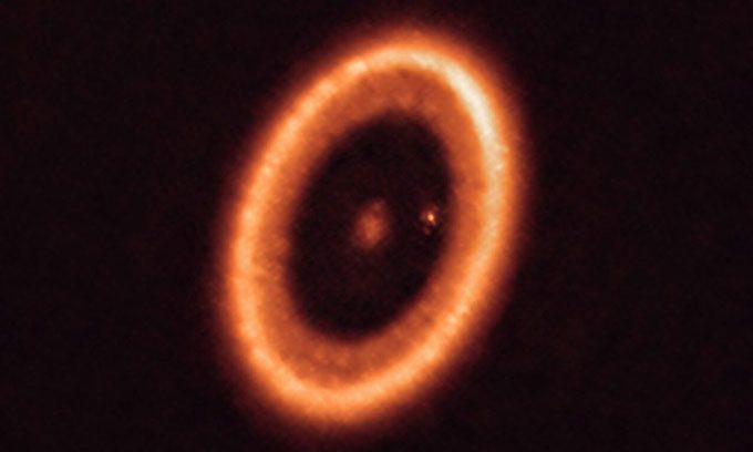 The PDS 70 star system with the host star PDS 70 in the center and the planet PDS 70c (small dot on the right).