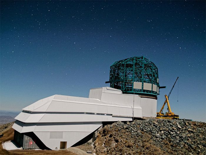 Large survey telescope building at the Vera Rubin Observatory in Cerro Pachón, Chile.