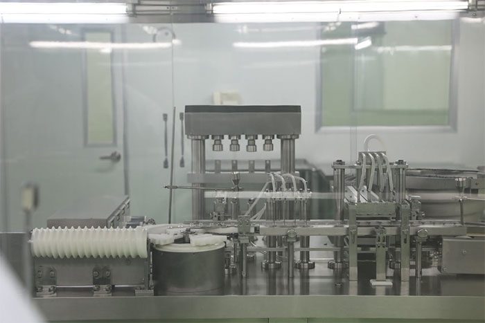 Sterile glass vials will be placed on the conveyor belt