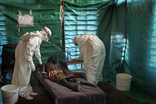 A doctor treating a suspected Ebola patient in Congo in 2007.