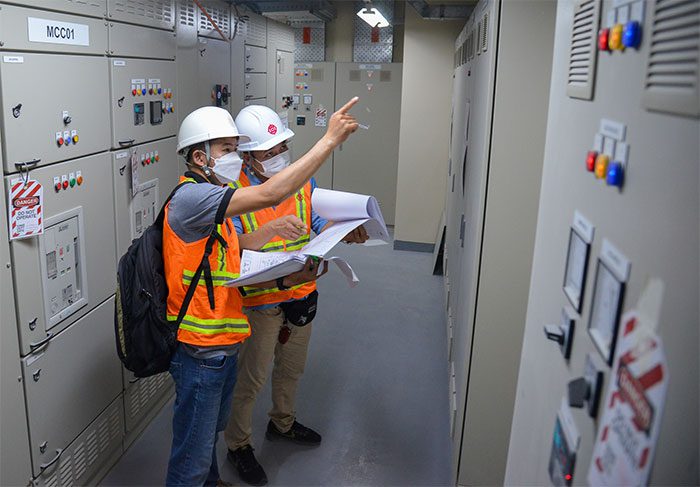Engineers are checking the electrical equipment room in the station