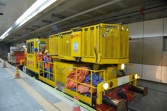 The freight train moves smoothly between the underground stations
