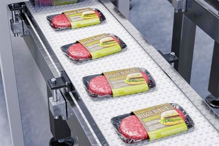 Illustration of a production line for "fake" meat sandwiches