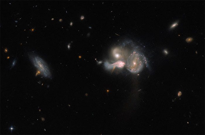 Image of 3 merging galaxies captured by the Hubble telescope