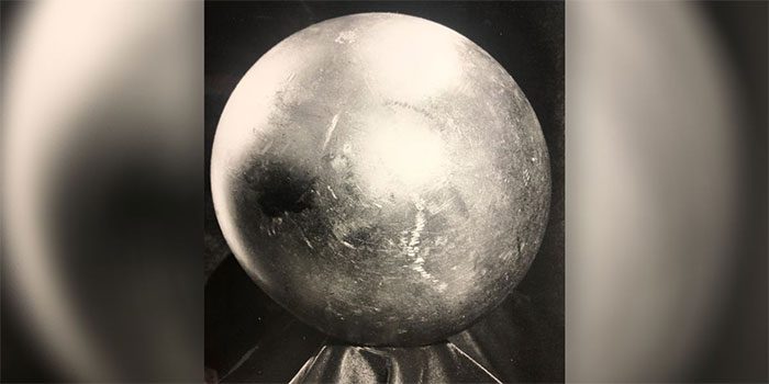 Shiny metal ball with a diameter of about 20cm.