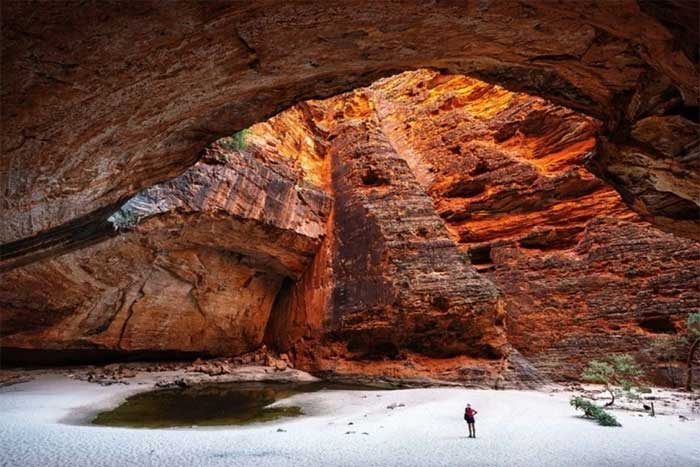 Hidden within this captivating site are deep gorges, narrow chasms, palm trees, and seasonal waterfalls.