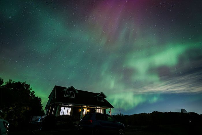 Northern lights appearing above a house near Cremona, Canada, on October 7.