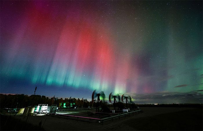 Northern lights over oil and gas drilling rigs near Cremona, Alberta, Canada, on October 10.