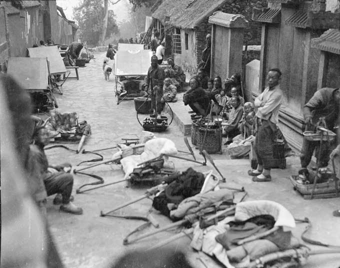 Laborers waiting outside a temple in Shandong Province.