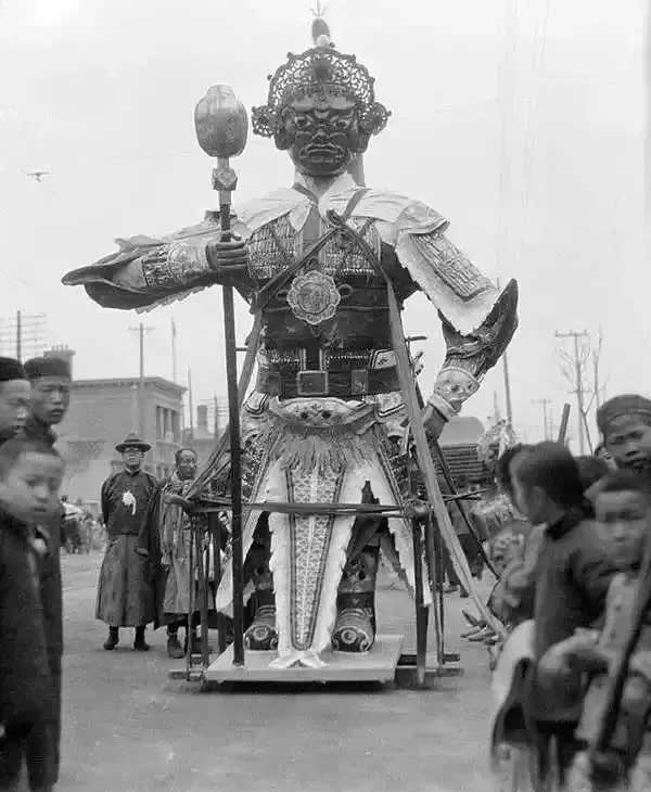 A giant paper effigy carried in a funeral procession in Beijing.