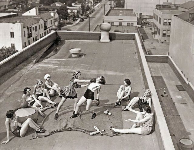 Women boxing on a rooftop, 1938