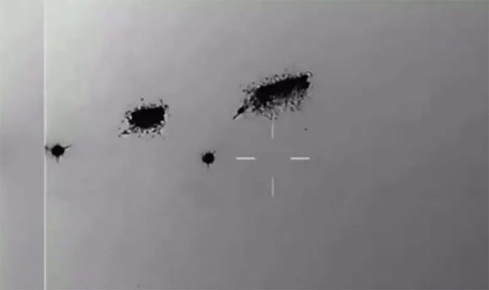 Thermal camera captures two "flying saucers" seemingly exploding after being hit by a missile