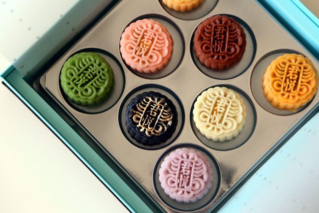 Sticky mooncakes with durian filling, like other mooncakes in Singapore, are inspired by the Chinese "snow skin" cake.