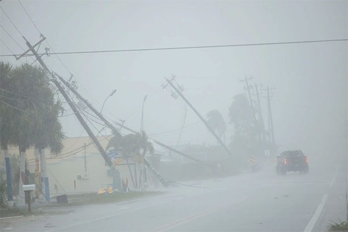 Trees and downed power poles in Fort Myers, Florida as Hurricane Milton made landfall