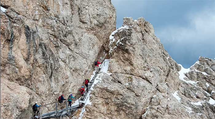 Here are stairs, cables, and steel ladders built into the rock, assisting climbers.