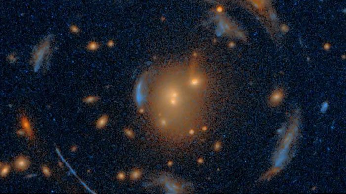 The mysterious structure of 7 galaxies distorted by a foreground galaxy cluster