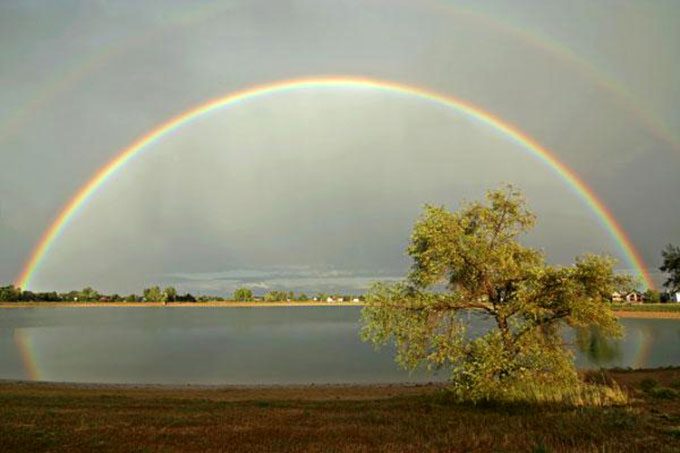 Rainbow over Harper Lake in Louisville, Colorado, USA.