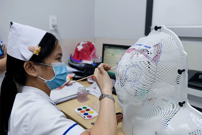 With the completed masks, nurses will draw various designs on them.