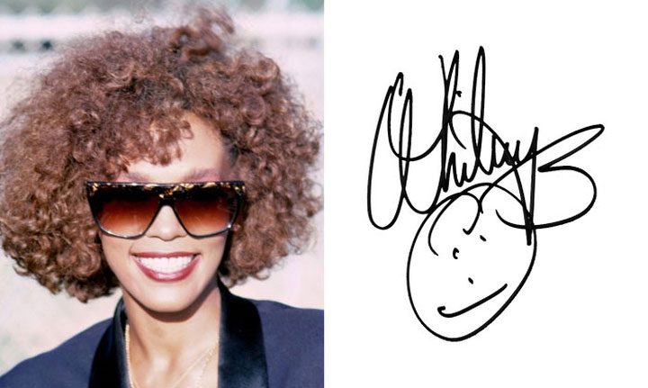 Whitney Houston drew a funny smiley face beneath her elaborate signature.