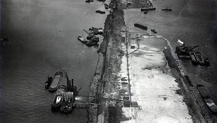 Building a dam in the sea at the bay entrance is an extremely labor-intensive and costly task...