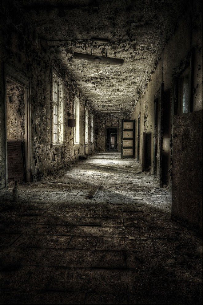 The corridor appears dark and deserted.