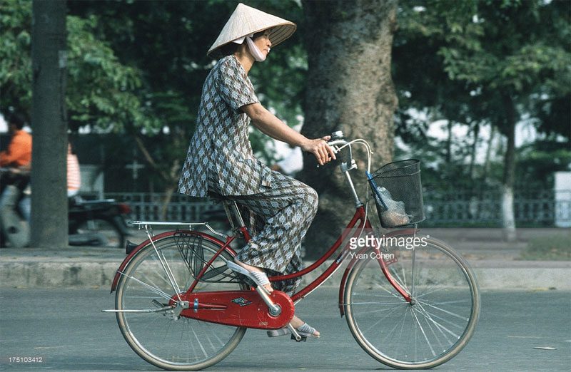 A woman on a Japanese mini bicycle.