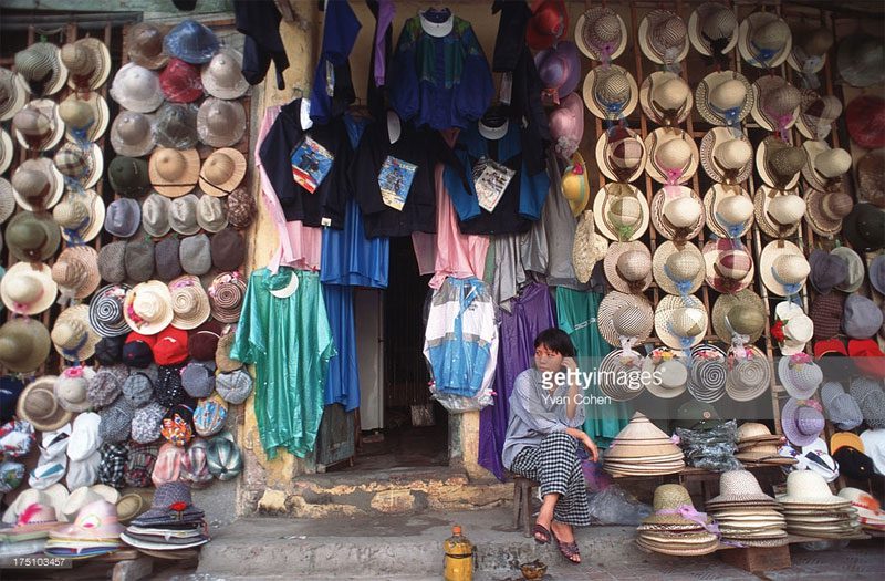 Outside a conical hat shop.