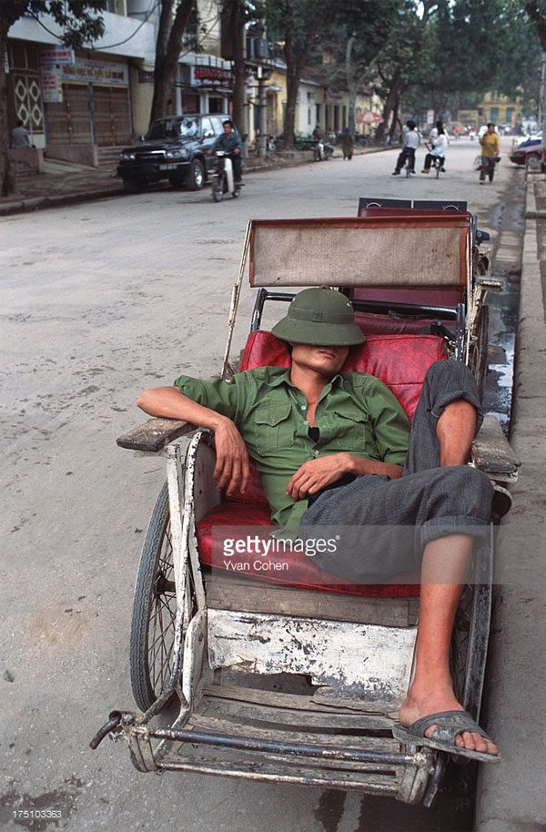 A cyclo driver taking a nap.