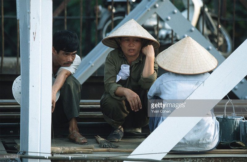 Workers repairing a bridge.