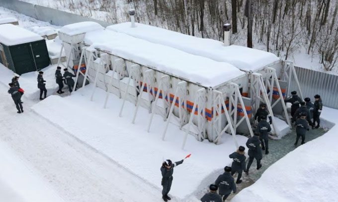 Emergency personnel entering a mobile bomb shelter against radiation in Nizhny Novgorod