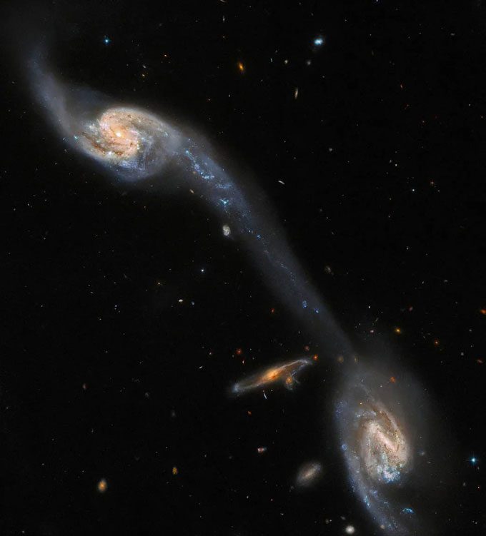 The Arp 248 galaxy triplet captured by the Hubble Telescope.