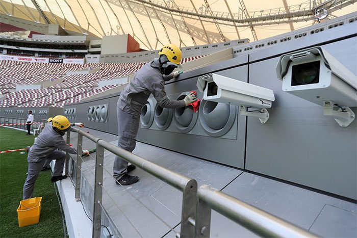 Workers installing the cooling system at the 2022 World Cup stadium.