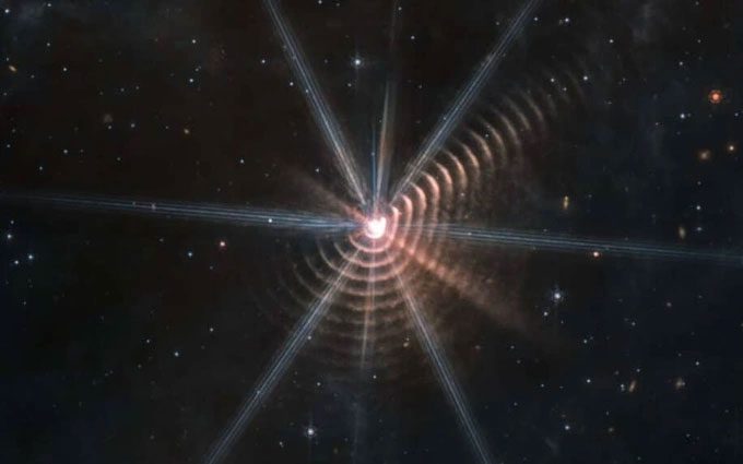 Strange concentric shells surrounding the distant star WR 140