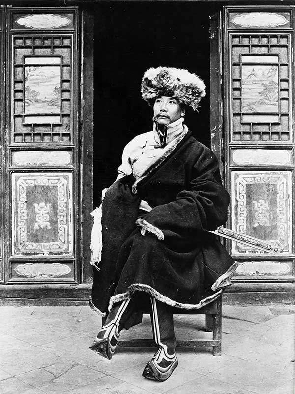 Yang-Chi-ching, a prince during the Qing Dynasty (China) posing in front of his house.