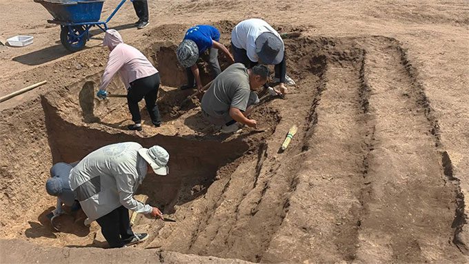 Archaeologists excavating the ancient tomb in Chaoyang City, Inner Mongolia - China