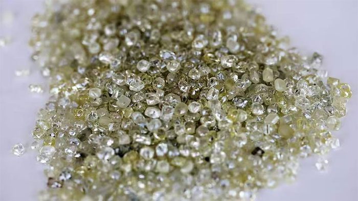 Diamonds are formed from carbon atoms subjected to extreme temperatures and pressures.