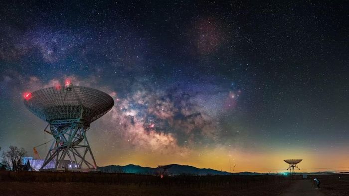 Radio telescopes scanning the universe for signs of extraterrestrial intelligence.