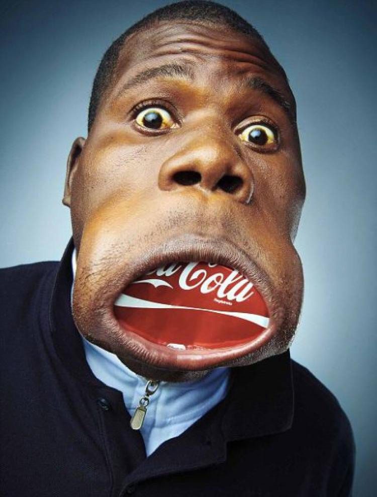 This mouth can fit a can of Coke without any issue.