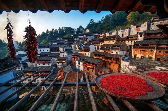 Houses made primarily of brick, wood, and stone, with wooden frames as the main structure.