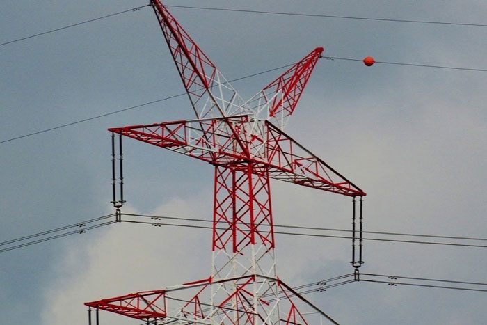 Balls are typically placed on high-voltage power lines near airports, commonly colored red and orange.