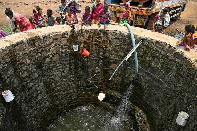 Drawing water from a well in Shahapur district, Maharashtra, India.