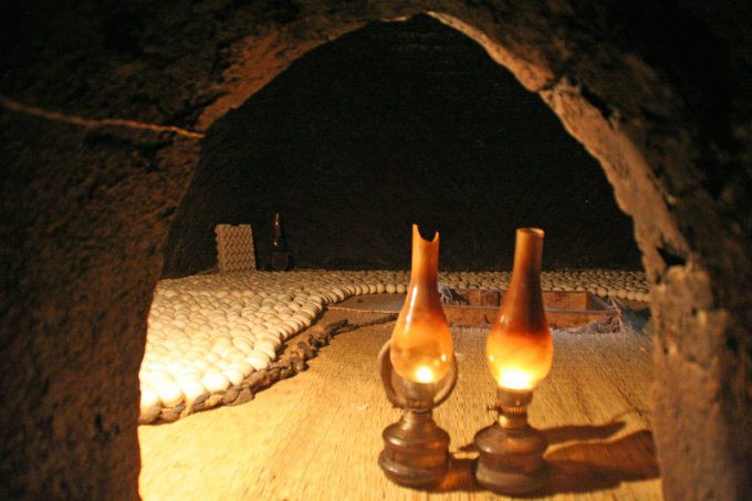 A traditional Egyptian incubator using an oil lamp to heat the eggs.