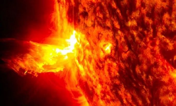 Solar flare emitted from the surface of the Sun.