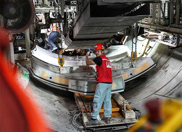 Six concrete tunnel lining panels will fit together to form a circle.