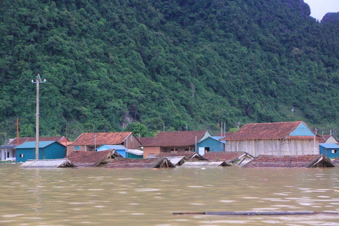 Floodwaters reaching the rooftops of homes in Tan Hoa tourist village on September 21.