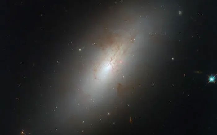 The perplexing object NGC 4694