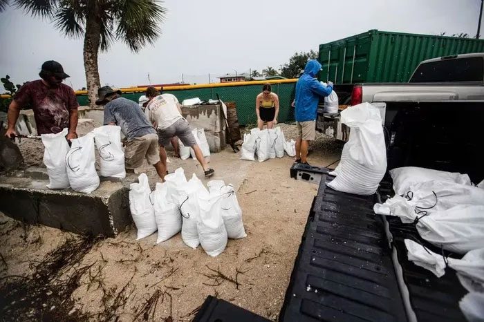 Residents fill sandbags on Fort Myers Beach, Florida.