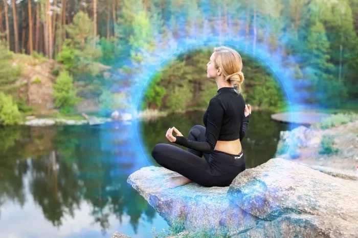 An aura is a multicolored glow surrounding a person or object, reflecting a special energy state.