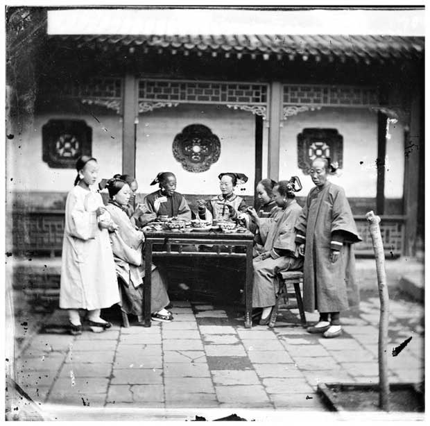 A gathering of noblewomen enjoying tea and casual conversation